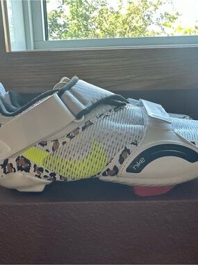 Nike White Spin/Cycle Shoe with Neon Yellow Swoosh and Leopard Accents